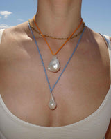 Blue silk cord necklace with baroque pearl pendant 